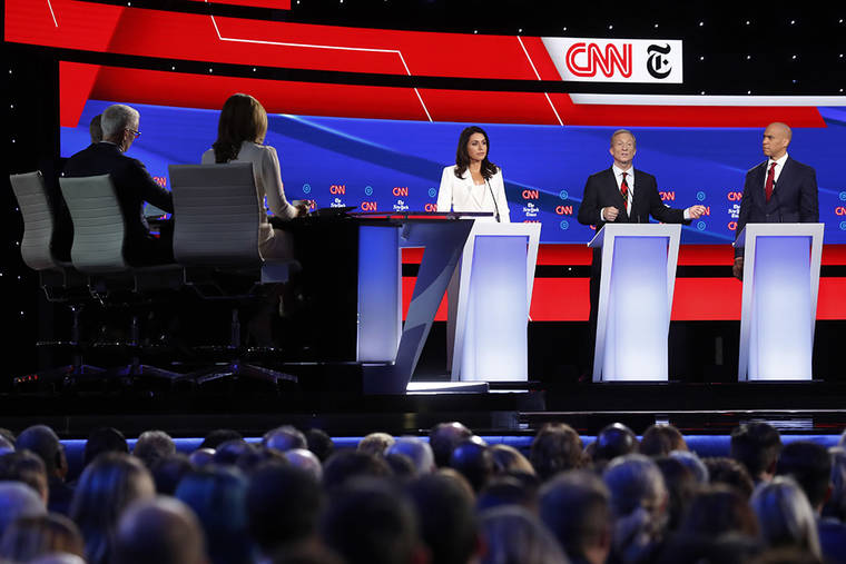 ASSOCIATED PRESS
                                Democratic presidential candidate Rep. Tulsi Gabbard, D-Hawaii, businessman Tom Steyer, center, and Sen. Cory Booker, D-N.J., right, participate in a Democratic presidential primary debate hosted by CNN/New York Times at Otterbein University, today.
