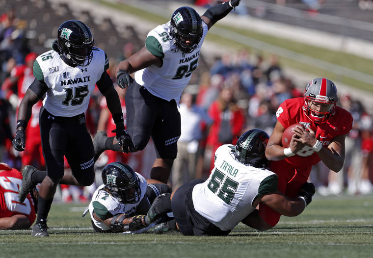 ASSOCIATED PRESS
                                New Mexico quarterback Tevaka Tuioti (8) is sacked by Hawaii defensive lineman Blessman Ta’ala (55) during the first half of an NCAA college football game in Albuquerque, N.M.