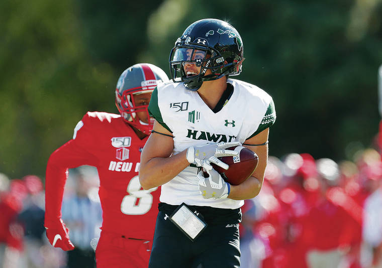 ANDRES LEIGHTON / ASSOCIATED PRESS
                                Hawaii wide receiver Kumoku Noa raced past New Mexico cornerback Donte Martin for a 54-yard touchdown during the first half of Saturday’s game in Albuquerque, N.M. Noa finished with 120 yards on four receptions in his season debut.
