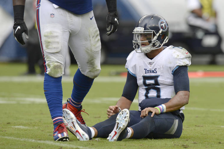 ASSOCIATED PRESS
                                Tennessee Titans quarterback Marcus Mariota (8) sits on the turf after a play against the Buffalo Bills in the second half of an NFL football game today in Nashville, Tenn.