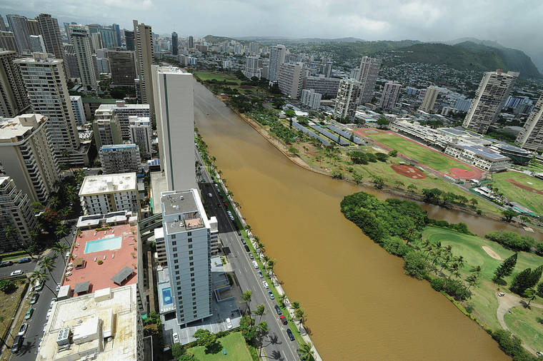 BRUCE ASATO / BASATO@STARADVERTISER.COM
                                Heavy rains from the remnants of Hurricane Lane in August 2018 turned the water brown in the Ala Wai Canal and the Manoa-Palolo Drainage Canal, which borders Iolani School and feeds into the canal.