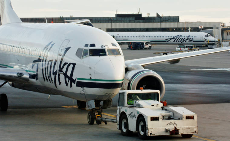 BLOOMBERG / 2005
                                An Alaska Airlines jet is pushed back from a gate at Ted Stevens International Airport in Anchorage, Alaska.