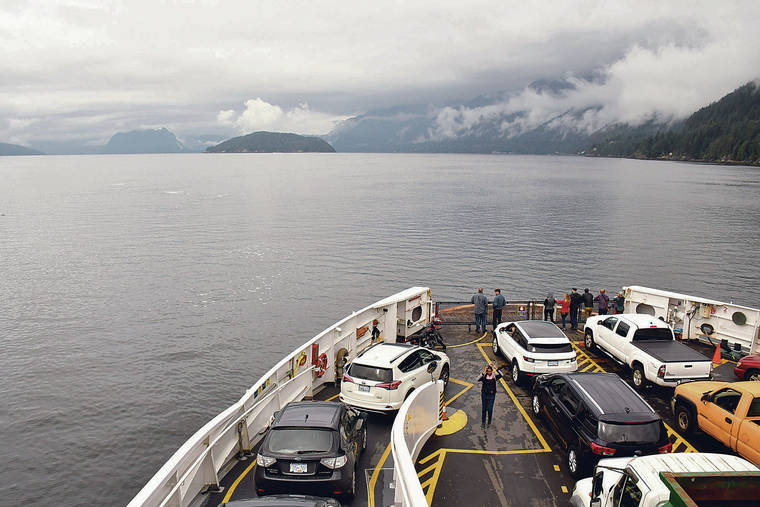 LOS ANGELES TIMES / TNS
                                A ferry makes its way to Snug Cove on Bowen Island in British Columbia, Canada.