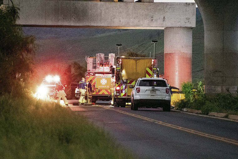 CRAIG T. KOJIMA / CKOJIMA@STARADVERTISER.COM 
                                HFD responded Wednesday to the scene where a vehicle crashed into a pillar killing the driver, a passenger and a dog. The occupants have not been identified.
