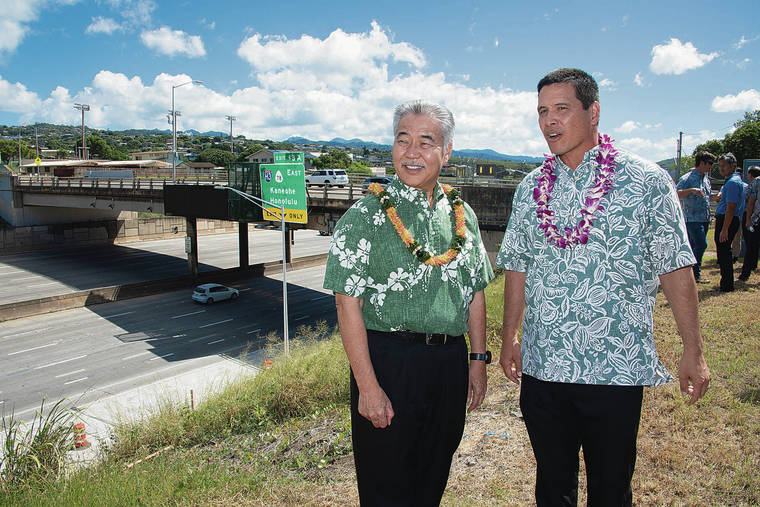 CRAIG T. KOJIMA / CKOJIMA@STARADVERTISER.COM
                                The state Department of Transportation held a blessing ceremony to mark the ahead-of-schedule completion of the H-1 freeway paving and shoulder widening project. Gov. David Ige, left, and DOT Highways Division Deputy Director Ed Sniffen looked out Monday over a finished section of highway between the Waimalu Viaduct and the Aiea Pedestrian Overpass.
