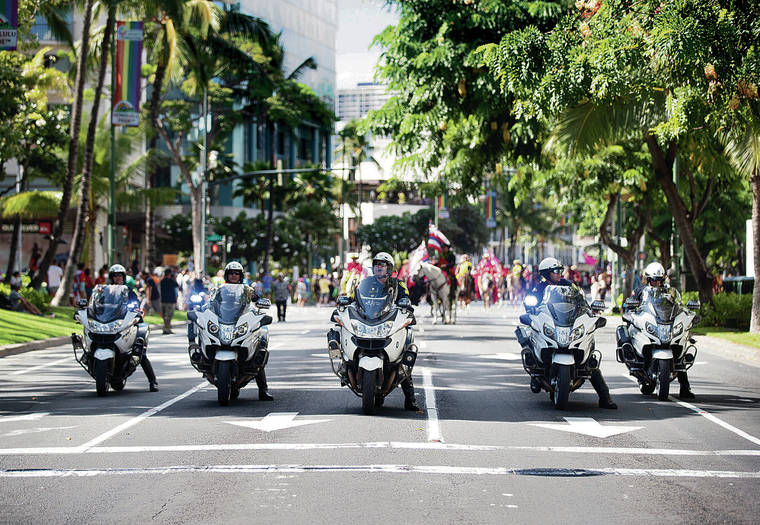 CINDY ELLEN RUSSELL / CRUSSELL@STARADVERTISER.COM
                                Honolulu police officers were on motorcycles at the march along Kalakaua Avenue on Saturday.