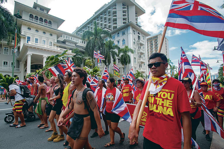CINDY ELLEN RUSSELL / CRUSSELL@STARADVERTISER.COM
                                Participants walked Saturday through Waikiki on Kalakaua Avenue, which was closed for several hours.