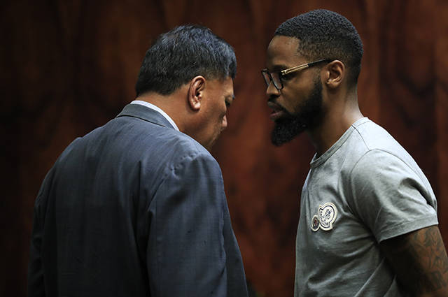 JAMM AQUINO/JAQUINO@STARADVERTISER.COM
                                Isaiah McCoy, right, listens to advice from appointed counsel Barry Sualu in the state circuit courtroom of Judge Todd Eddins today. The prosecution requested that McCoy’s bail be revoked after he was apprehended October 7 at Daniel K. Inouye International Airport, trying to leave on a flight to Los Angeles.