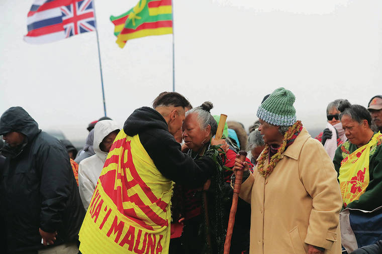 JAMM AQUINO / JULY 22
                                TMT protesters say they will be ready for winter at Mauna Kea. Shown here during the seventh day of the protests are kumu hula Bradford Ikemanu Lum, left, and Noe Noe Wong-Wilson.