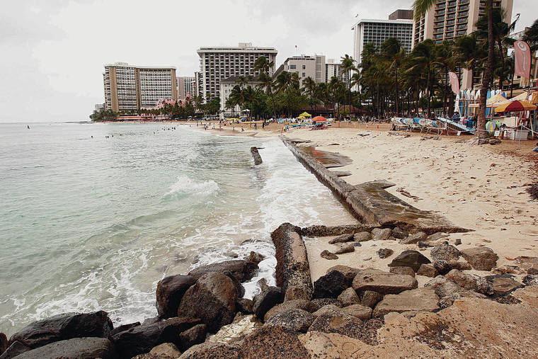 JAMM AQUINO/JAQUINO@STARADVERTISER.COM
                                Erosion at Kuhio Beach periodically exposes an old foundation from a tavern that was demolished several decades ago. Exposed concrete from beach erosion is visible in Waikiki.