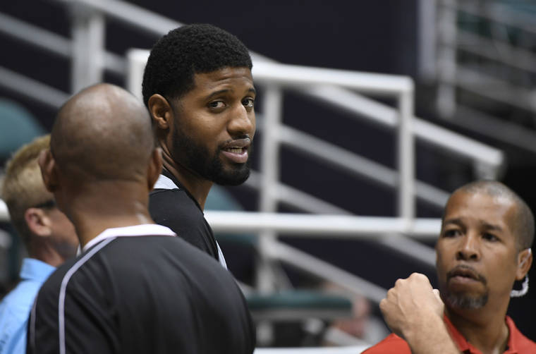 BRUCE ASATO / BASATO@STARADVERTISER.COM
                                Paul George of the Los Angeles Clippers looks during today’s practice.