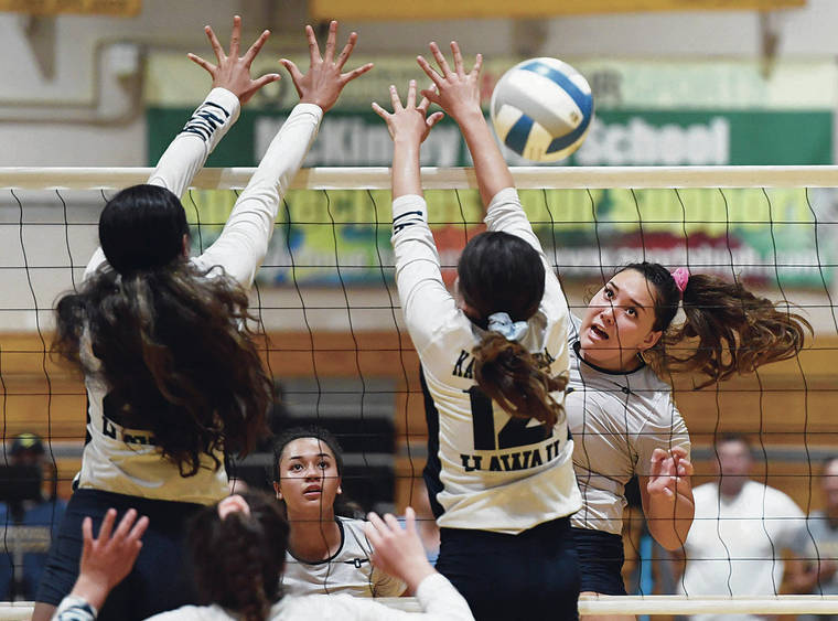 BRUCE ASATO / BASATO@STARADVERTISER.COM
                                Punahou’s Madisyn Beirne hit down the line for a kill past Kamehameha-Hawaii’s Megan Baldado in the third set of a quarterfinal match in the HHSAA Girls Volleyball tournament at McKinley on Thursday.