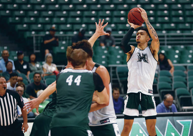 CINDY ELLEN RUSSELL / CRUSSELL@STARADVERTISER.COM
                                Hawaii junior Samuta Avea took aim on a shot during the Rainbow Warriors’ Green and White scrimmage at the Stan Sheriff Center on Saturday.