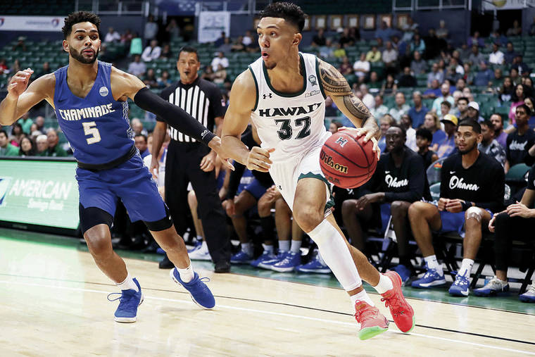 ANDREW LEE / SPECIAL TO THE STAR-ADVERTISER
                                Hawaii’s Samuta Avea drove by Chaminade’s Telly Davenport during the first half at the Stan Sheriff Center.
