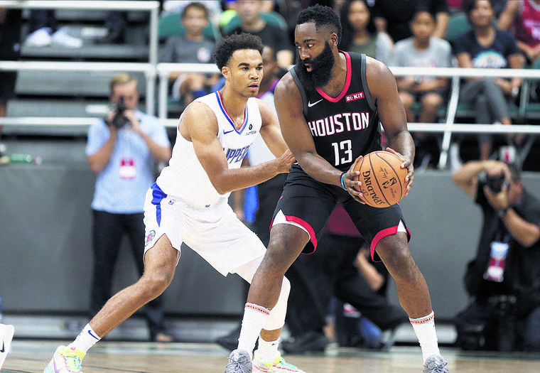JAMM AQUINO / JAQUINO@STARADVERTISER.COM
                                Houston Rockets guard James Harden kept the ball away from Clippers guard Jerome Robinson during the first half.