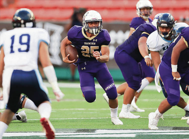 JAMM AQUINO / JAQUINO@STARADVERTISER.COM
                                Damien running back Apereamo “Amo” Sulu looked for an opening against Kailua on Sept. 27 at Aloha Stadium. Sulu has rushed for 1,111 yards and 13 touchdowns this season.