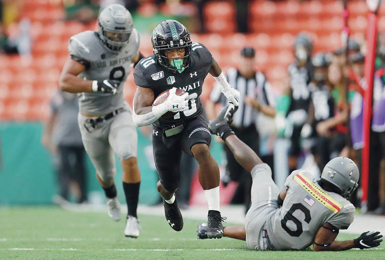 JAMM AQUINO/JAQUINO@STARADVERTISER.COM
                                Hawaii wide receiver Melquise Stovall stays ahead of Air Force cornerback Zane Lewis (6), left, and linebacker Lakota Wills (8) on the way to a touchdown during the first half of Saturday’s game.