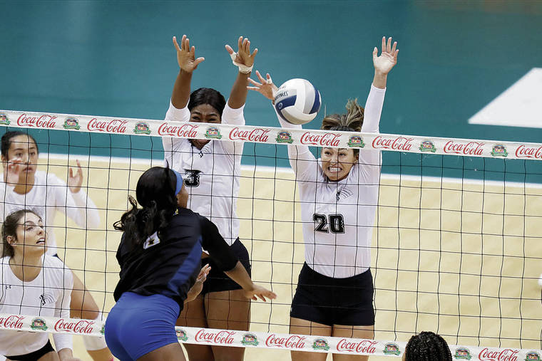 ANDREW LEE / SPECIAL TO THE STAR-ADVERTISER
                                UH’s Amber Igiede, left, and McKenna Ross blocked a kill attempt by UC Riverside’s Amarachi Osuji during the first set of Friday’s match.