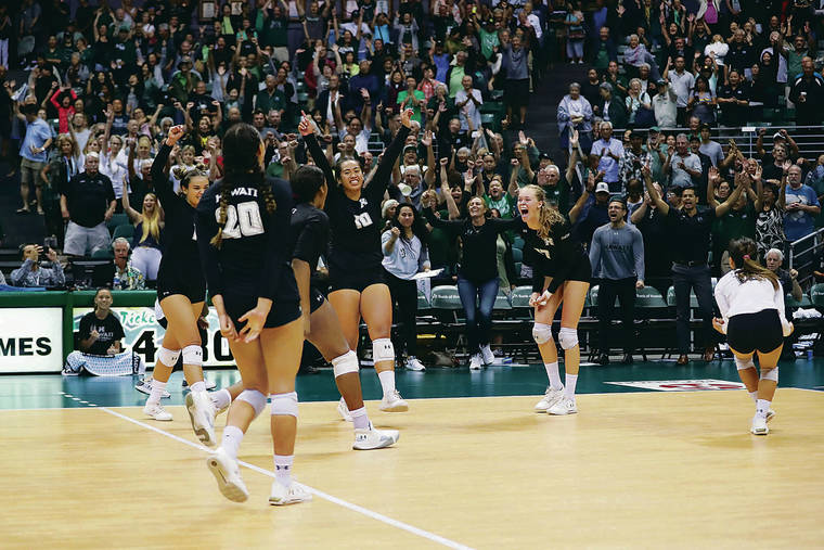 ANDREW LEE / SPECIAL TO THE STAR-ADVERTISER
                                Hawaii players celebrated after the Rainbow Wahine won the fifth set against Cal State Fullerton on Saturday at the Stan Sheriff Center. UH came back from two sets down to rally past the Titans.