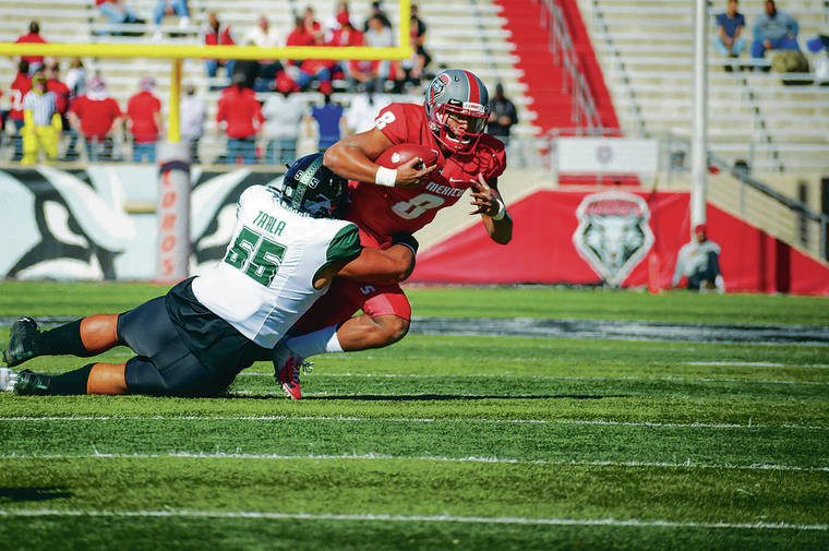 ANTHONY JACKSON / SPECIAL TO THE STAR-ADVERTISER
                                Hawaii defensive lineman Blessman Ta’ala tackled New Mexico quarterback Tevaka Tuioti during Saturday’s game at Dreamstyle Stadium in Albuquerque, N.M.