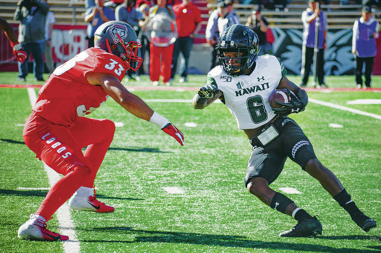 ANTHONY JACKSON / SPECIAL TO THE STAR-ADVERTISER
                                Hawaii receiver Cedric Byrd tried to evade New Mexico’s Alex Hart.