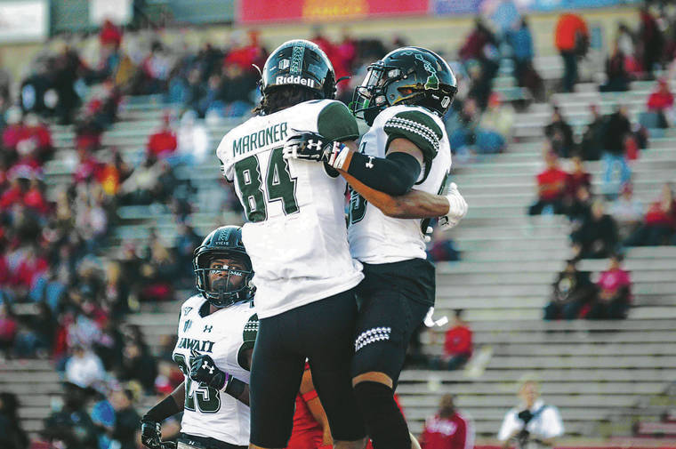 ANTHONY JACKSON / SPECIAL TO THE STAR-ADVERTISER
                                Rainbow Warriors’ wide receivers Nick Mardner, left, and Lincoln Victor celebrated Victor’s touchdown reception from Chevan Cordeiro in the fourth quarter.