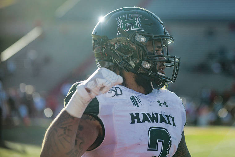ANTHONY JACKSON / SPECIAL TO THE STAR-ADVERTISER
                                Hawaii linebacker Jeremiah Pritchard pumped his fist during the Rainbow Warriors’ win at New Mexico on Saturday. Pritchard had five tackles, including a sack, against the Lobos.