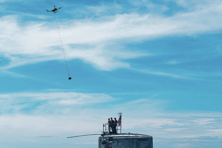 U.S. NAVY
                                An unmanned aerial vehicle delivers a 5-pound payload to the Virginia-class fast-attack submarine USS Hawaii during a training exercise off the coast of Oahu.