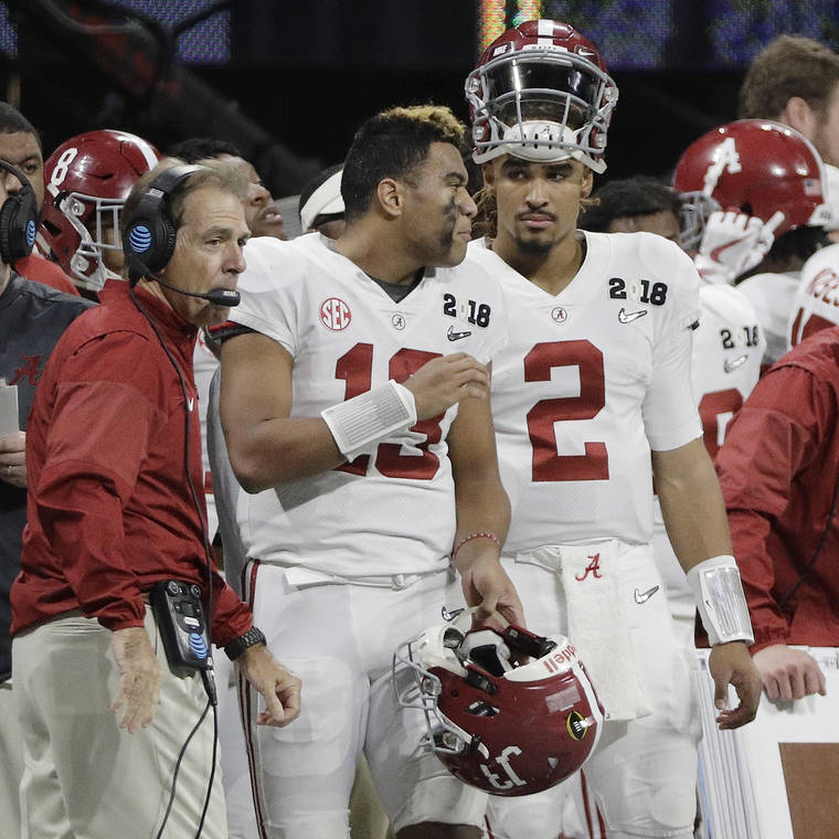 ASSOCIATED PRESS / Jan. 8, 2018
                                Alabama’s Jalen Hurts (2) talks with Tua Tagovailoa (13) during the second half of the NCAA college football playoff championship game against Georgia on Jan. 8, 2018, in Atlanta. Once teammates, the two are now competing for the Heisman Trophy with Hurts playing for Oklahoma.