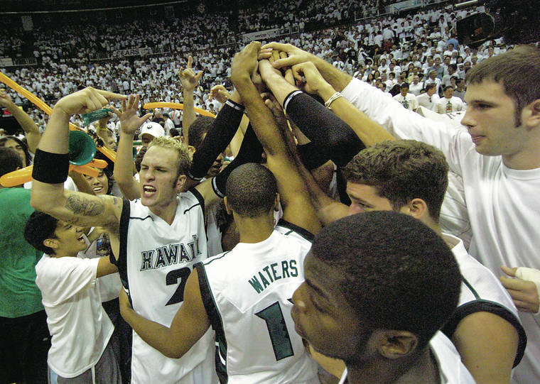 STAR-ADVERTISER FILE
                                Hawaii’s Matt Gibson, left, and his Rainbow Warrior teammates celebrated after their 84-62 upset win over No. 4 Michigan State in the 2005 season opener.