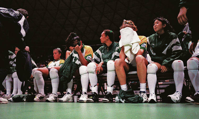 STAR-ADVERTISER / 1995
                                The Rainbow Wahine sat dejectedly after their loss to Michigan State in five sets.