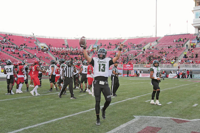 STEVEN ERLER / SPECIAL TO THE STAR-ADVERTISER
                                Hawaii quarterback Cole McDonald waved to the crowd after the Rainbow Warriors became bowl eligible with a over UNLV on Saturday in Las Vegas.