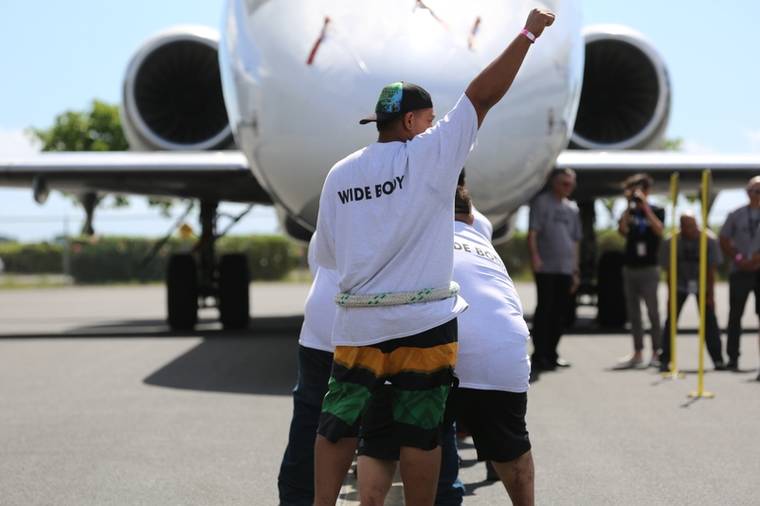 COURTESY HAWAIIAN AIRLINES
                                Hawaiian Airlines marked its 90th anniversary by holding the Great Hawaiian Plane Pull, which revived charity plane-pulling competitions of the 1980s.