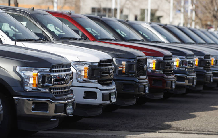 ASSOCIATED PRESS
                                A long row of unsold 2020 F-150 pickup trucks sits at a Ford dealership in Littleton, Colo., on Nov. 10.