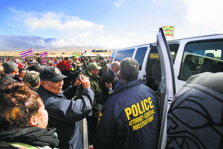 CINDY ELLEN RUSSELL / CRUSSELL@STARADVERTISER.COM
                                Law enforcement arrest kupuna who barricaded Mauna Kea Access Road on July 17, 2019. The state and counties have spent more than $11 million on law enforcement costs in connection with 16 weeks of protests against the Thirty Meter Telescope.