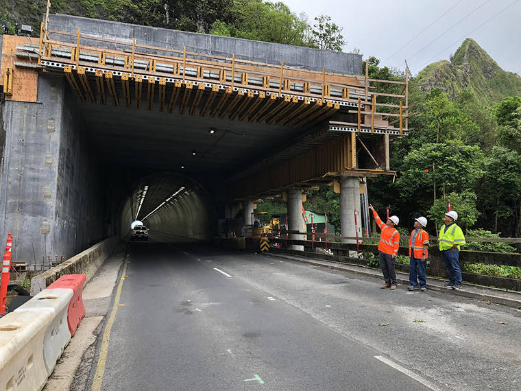 COURTESY HAWAII DEPARTMENT OF TRANSPORTATION
                                In this undated photo, crews work on the construction of a new “rock shed” at the entrance of a town-bound tunnel on Pali Highway to shield the roadway and motorists from potential falling debris.