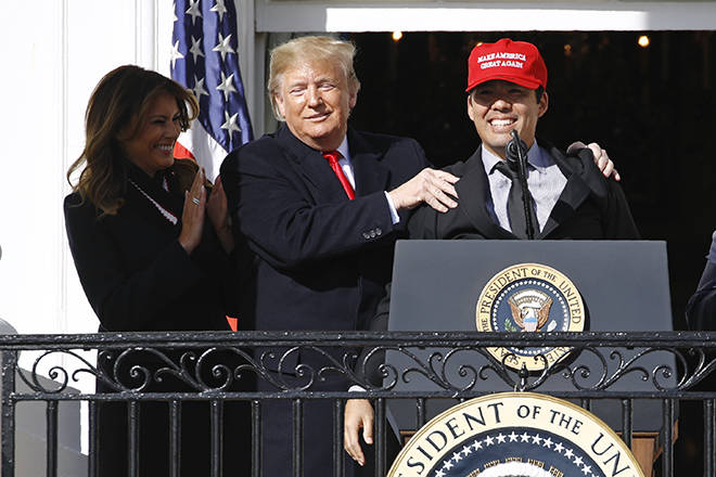 ASSOCIATED PRESS
                                President Donald Trump embraces Washington Nationals catcher Kurt Suzuki, right, as Suzuki speaks during an event to honor the 2019 World Series champion Nationals baseball team at the White House today in Washington. Standing alongside Trump is first lady Melania Trump.