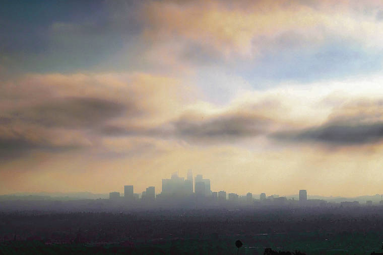 ASSOCIATED PRESS
                                Downtown Los Angeles, shrouded in early morning coastal fog and smog.