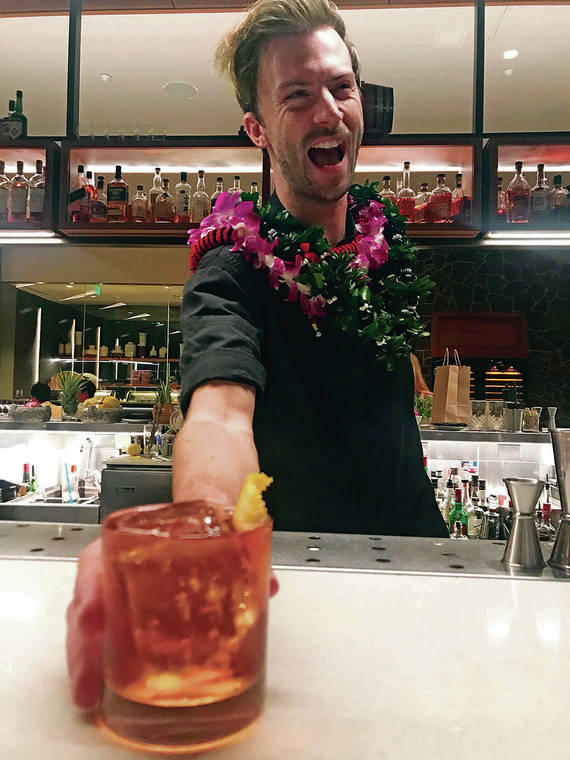 JASON GENEGABUS / JASON@STARADVERTISER.COM
                                Andrew Woodley was all smiles during his last shift mixing drinks at Stripsteak Waikiki last month.