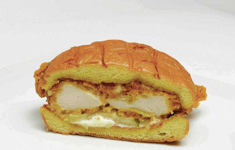 BRUCE ASATO / BASATO@STARADVERTISER.COM
                                Popeye’s new chicken sandwich, which generated so much buzz on the mainland that Popeye’s ran out of chicken for a while. It’s finally available in Hawaii.