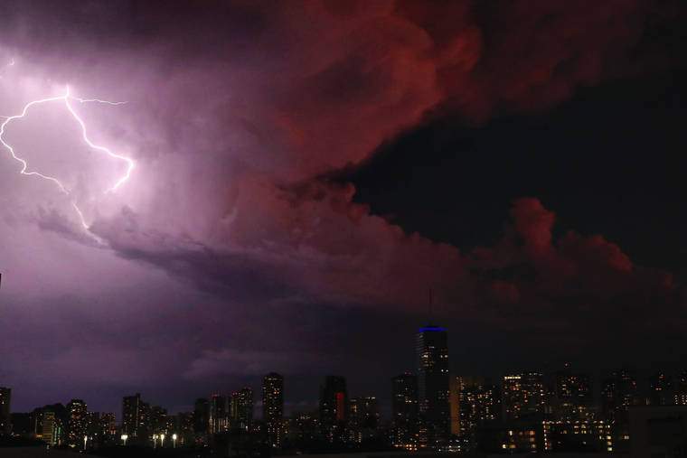 JAMM AQUINO / JAQUINO@STARADVERTISER.COM
                                Lightning illuminates the sky over Waikiki Monday night.