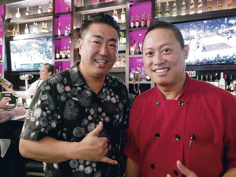 BETTY SHIMABUKURO / BETTY@STARADVERTISER.COM
                                Ho Suk Lee, left, and Bo Pathammavong, have opened the new Ya-Ya’s Chophouse & Seafood.