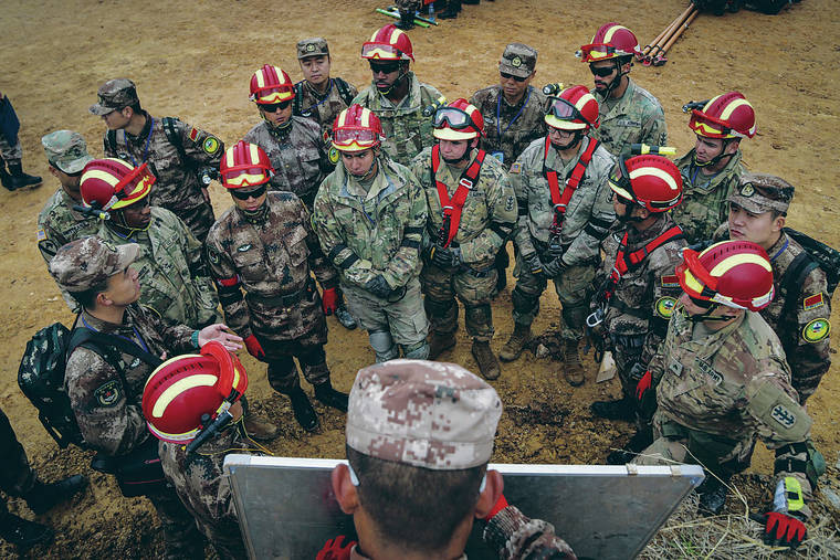 COURTESY U.S. ARMY / 2018
                                Soldiers of the U.S. Army and China’s People’s Liberation Army receive instructions for the day during a field exercise for the Disaster Management Exchange in Nanjing, China. The exercise is an annual disaster risk reduction event, which underscores the commitment of both U.S. and China to address humanitarian assistance and disaster relief challenges across the region.