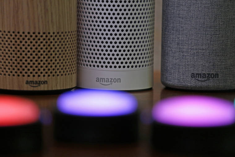 ASSOCIATED PRESS
                                Amazon Echo and Echo Plus devices, behind, sat near illuminated Echo Button devices during a Sept. 2017 event announcing several new Amazon products by the company in Seattle. Researchers in Japan and at the University of Michigan said Monday that they had found a way to take over Google Home, Amazon’s Alexa or Apple’s Siri devices from hundreds of feet away by shining laser pointers, and even flashlights, at the devices’ microphones.