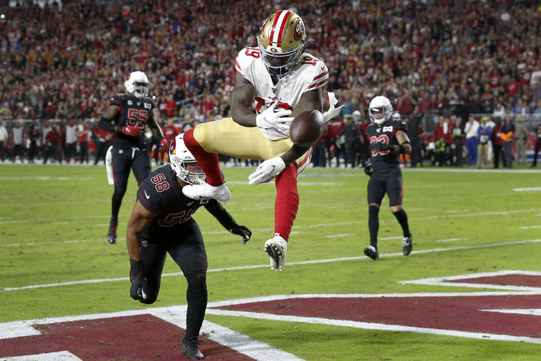 ASSOCIATED PRESS
                                San Francisco 49ers wide receiver Deebo Samuel couldn’t make the catch as Arizona Cardinals middle linebacker Jordan Hicks defended during the first half of a game, Thursday, in Glendale, Ariz.