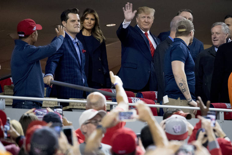 ASSOCIATED PRESS
                                President Donald Trump and first lady Melania Trump, third from left, arrive for Game 5 of the World Series baseball game between the Houston Astros and the Washington Nationals at Nationals Park in Washington on Sunday.