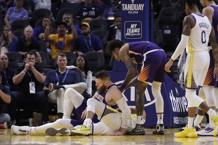 ASSOCIATED PRESS
                                Phoenix Suns’ Aron Baynes, left, gets up after falling onto Golden State Warriors’ Stephen Curry during the second half of an NBA basketball game Wednesday in San Francisco. \