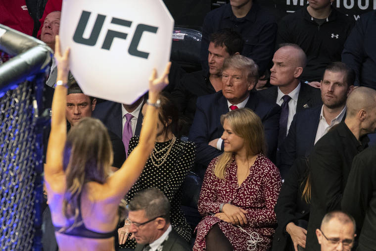 ASSOCIATED PRESS
                                President Donald Trump looked on during UFC 244 mixed martial arts fights, Saturday, in New York.