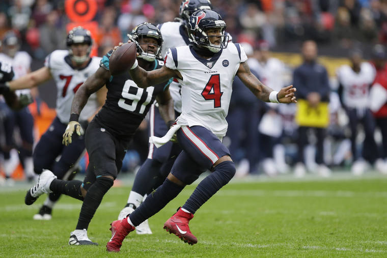 ASSOCIATED PRESS
                                Houston Texans quarterback Deshaun Watson ran out of the pocket under pressure by Jacksonville Jaguars defensive end Yannick Ngakoue during the first half of a game at Wembley Stadium, today, in London.