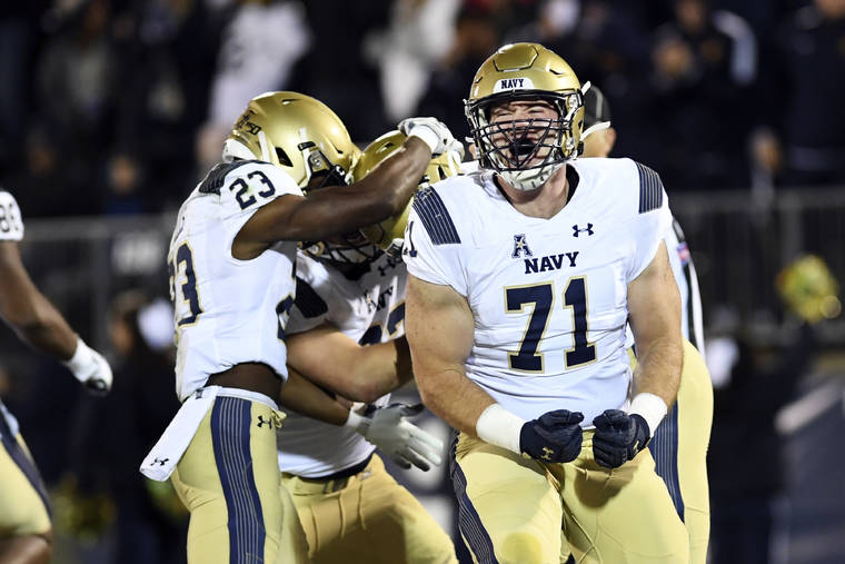 ASSOCIATED PRESS
                                Navy offensive tackle Billy Honaker screamed after wide receiver Mychal Cooper scored during the first half of a game against Connecticut, Friday, in East Hartford, Conn.